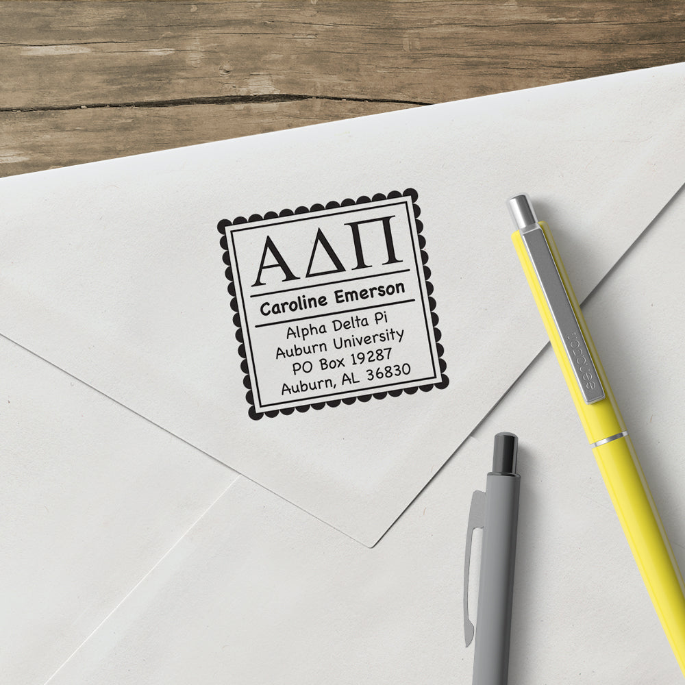 Alpha Delta Pi Address Custom Greek Stamp  Elevate your correspondence with this Designer Stamp®. Patented removable clip makes changing stamp designs clean and easy. One Stamper, Endless Possibilities®. Stamps are great for envelopes, notes, hang tags, promotional materials, and much more.  Full stamper includes device, design, and black ink (ink lasts for thousands of impressions).